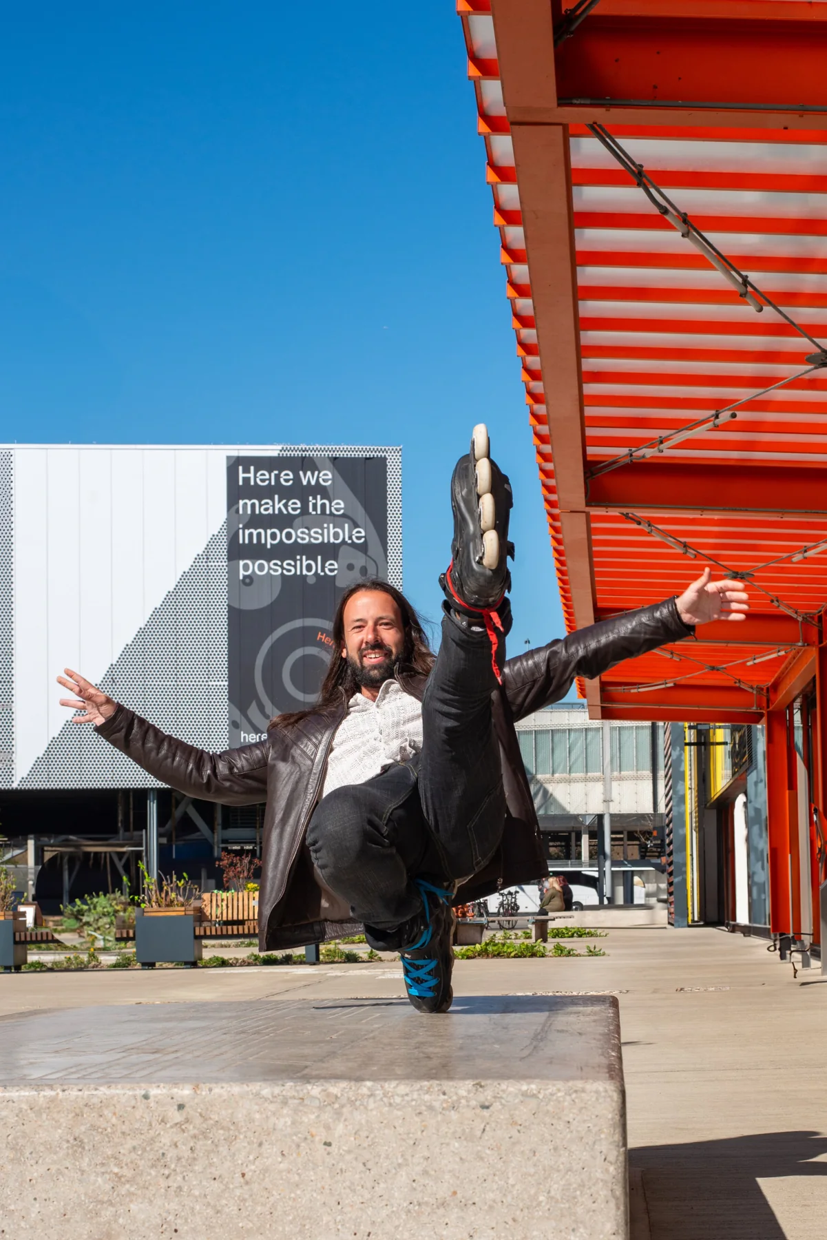 Adrian balancing on his inline skates with his arms outstretched