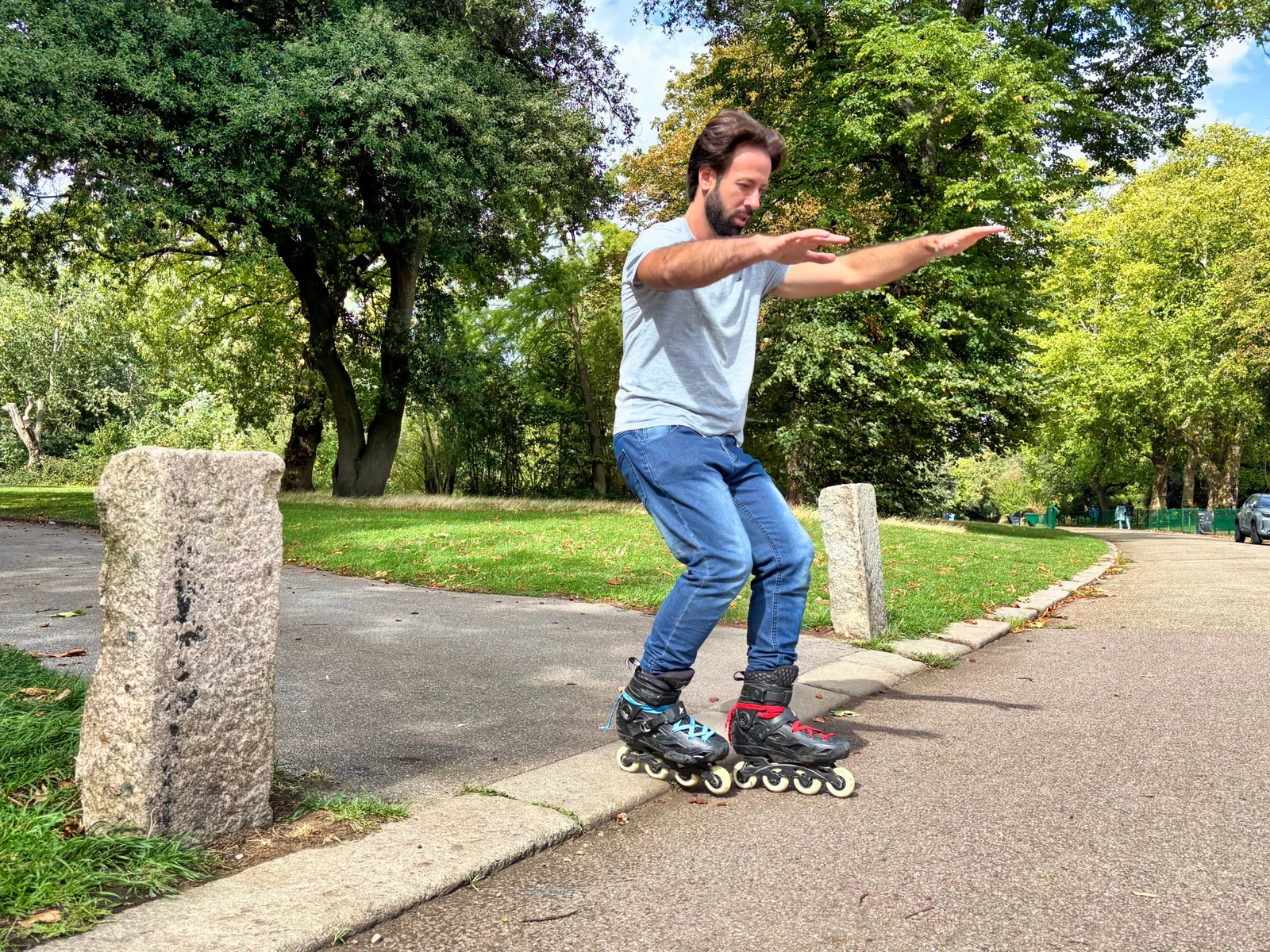 A skater practising posture and balance on a park path