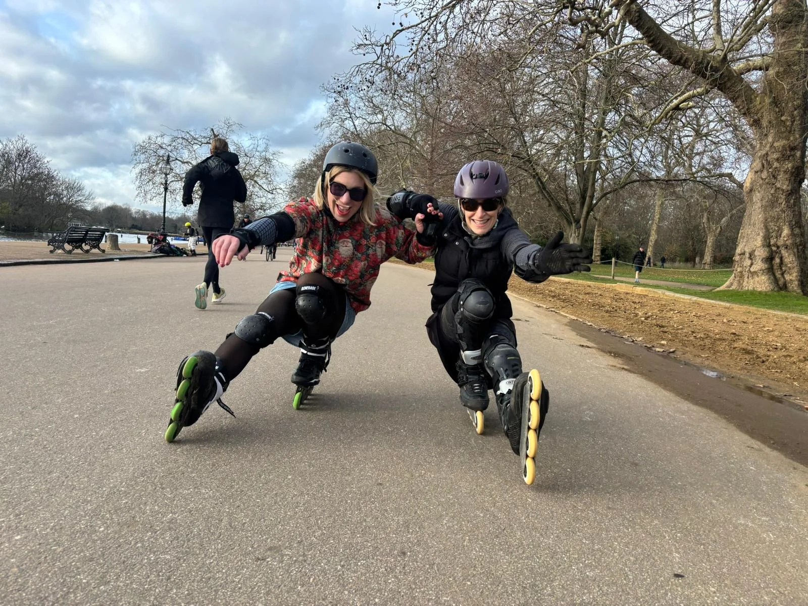 Two skaters practising a low balance position together